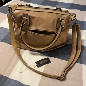 Women’s pocketbook. American leather with shoulder strap and shorter straps.